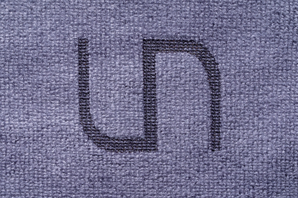 A close-up of branded UNS Microfiber Towel for aquariums