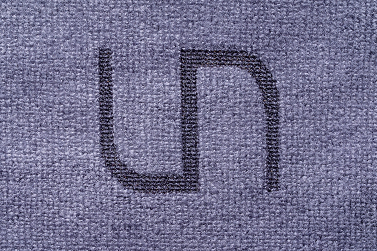 A close-up of branded UNS Microfiber Towel for aquariums